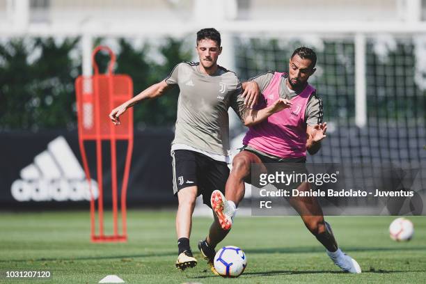 Juventus players Simone Emmanuello and Medhi Benatia during a training session at JTC on September 11, 2018 in Turin, Italy.