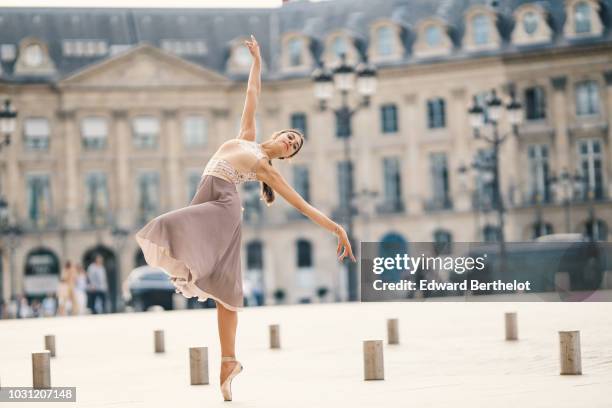 Amanda Derhy, ballet dancer, wears a leotard from Bloch, Repetto skirt and shoes, and performs dance moves, on September 9, 2018 in Paris, France.