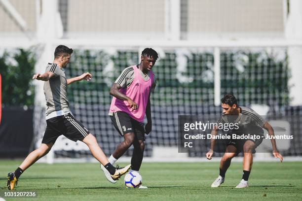 Juventus players Simone Emmanuello , Moise Kean and Biagio Morrone during a training session at JTC on September 11, 2018 in Turin, Italy.