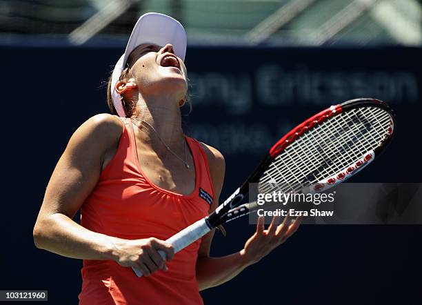 Ashley Harkleroad of the USA reacts after missing a shot in her match against Marion Bartoli of France during Day 2 of the Bank of the West Classic...