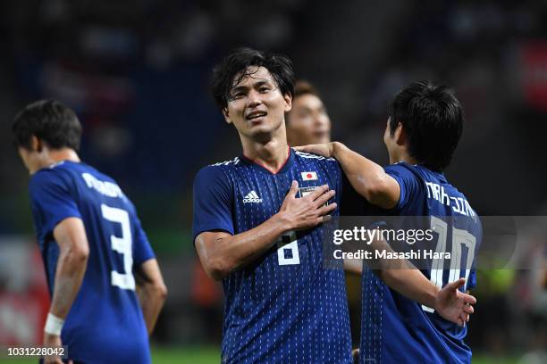 Takumi Minamino of Japan celebrates the second goal during the international friendly match between Japan and Costa Rica at Suita City Football...