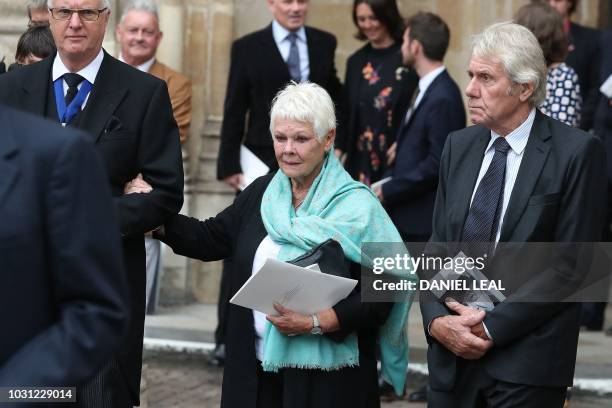 Actress Judi Dench leaves from Westminster Abbey in central London on September 11 after attending a service of thanksgiving for the late English...