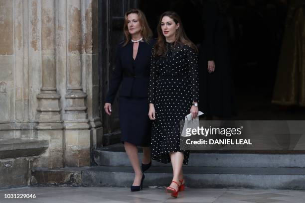 Nicki Frei, widow of Peter Hall, and their daughter Emma Hall, leave from Westminster Abbey in central London on September 11 after attending a...