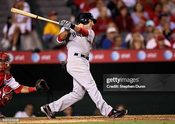 Jed Lowrie of the Boston Red Sox hits a two RBI double in the seventh inning against the Los Angeles Angels of Anaheim on July 27, 2010 at Angel...