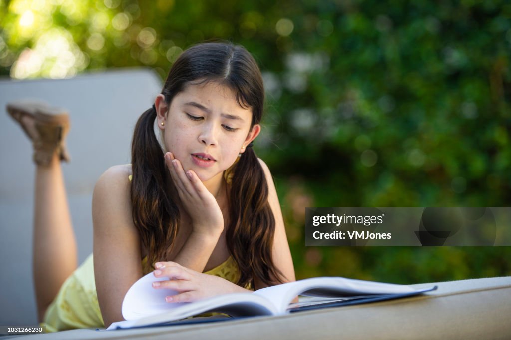 Young Mixed Race Girl Reading