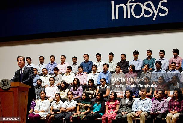 British Prime Minister David Cameron addresses delegates and employees of Infosys at the Infosys India headquarters on July 28, 2010 in Bangalore,...