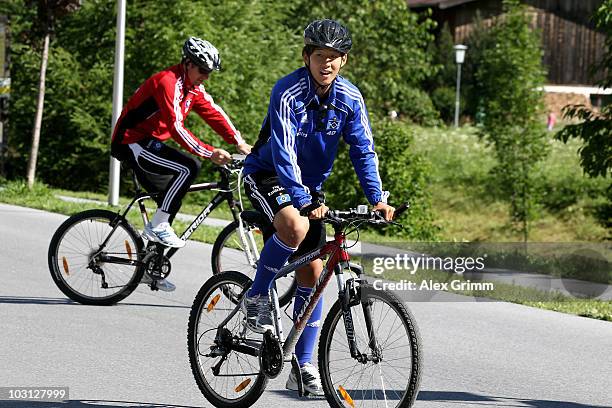 Heung-Min Son rides his bicycle during the pre-season training camp of Hamburger SV at the Aqua Dome hotel on July 28, 2010 in Langenfeld, Austria.