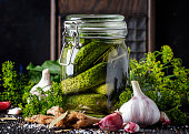 Homemade marinated or pickled cucumbers with dill, garlic and spices