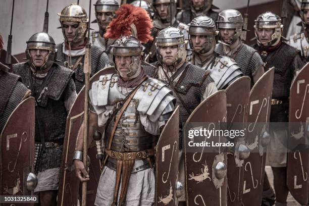 romans during a public performance - centurione stock pictures, royalty-free photos & images