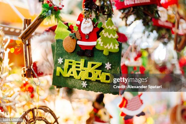 christmas and new year decorations at christmas market in barcelona, spain - feliz navidad stockfoto's en -beelden