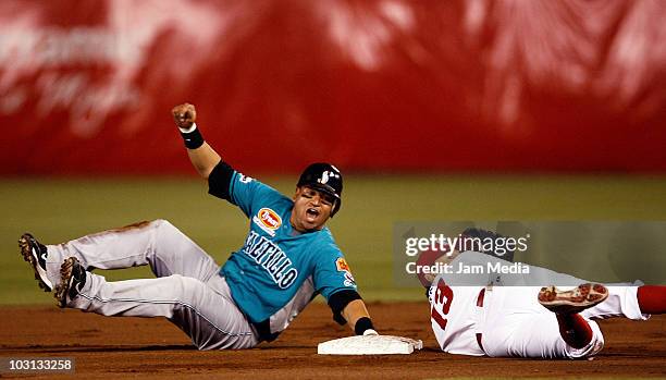 Hernando Arredondo of the Saraperos de Saltillo and Oscar Robles of Diablos Rojos de Mexico in action during the 2010 Mexican Baseball League...