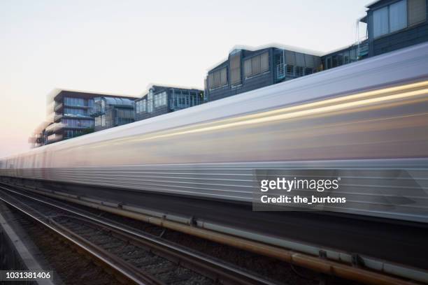 blurred motion of train - long exposure train stock pictures, royalty-free photos & images