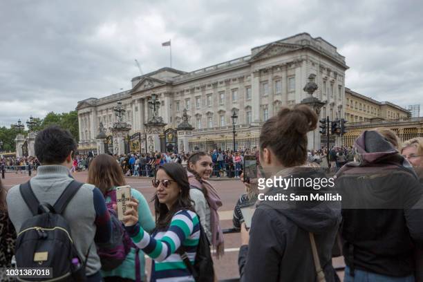 Tourists gather at Buckingham Palace to witness Changing of the Guards on the 27th August 2018 in Central London in the United Kingdom.