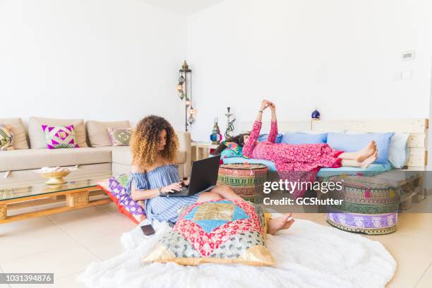 girls relaxing at home over the weekend - daily life in abu dhabi stock pictures, royalty-free photos & images