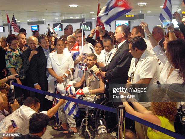 Cuban paraplegic dissident Ariel Sigler , flanked by his brother Miguel Sigler , a former political prisoner now living in exile in the United...