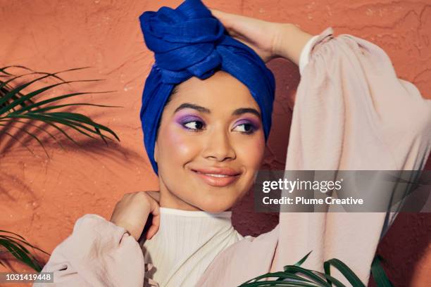 beautiful woman in hijab with hand on head - eye make up stock pictures, royalty-free photos & images