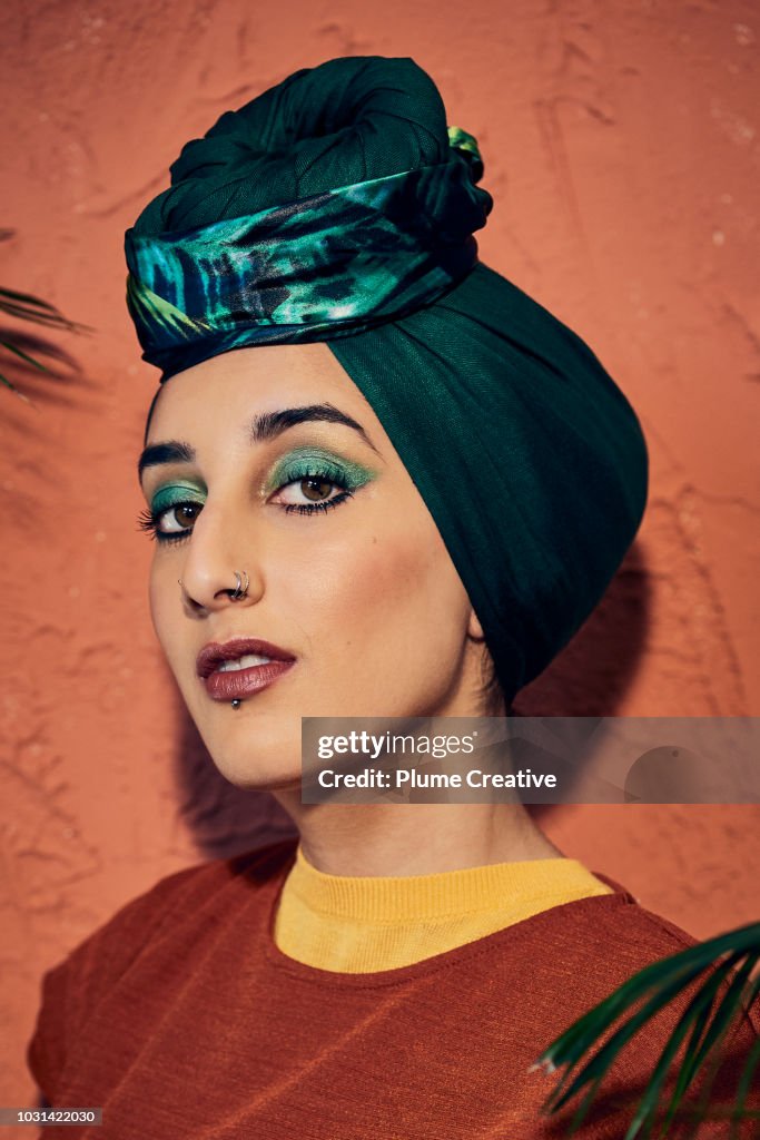 Young Muslim woman in green 70's style hijab