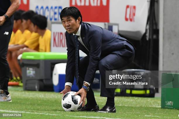 Hajime Moriyasu coach of Japan holds the ball during the international friendly match between Japan and Costa Rica at Suita City Football Stadium on...