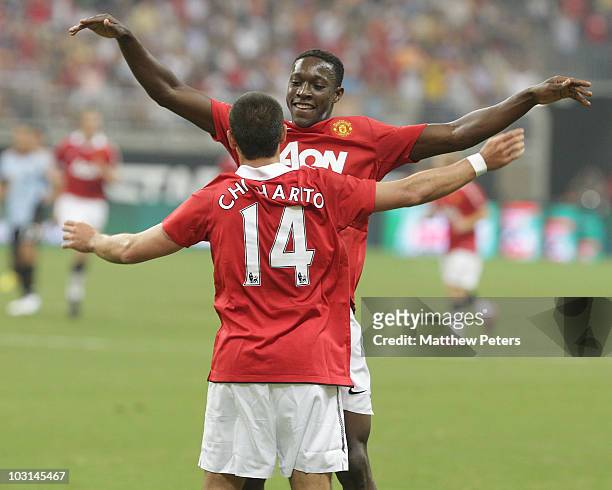 Javier "Chicharito" Hernandez of Manchester United celebrates scoring their fifth goal - his first for the club - with Danny Welbeck during the MLS...