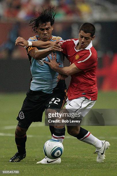 Wilman Conde of the MLS All-Stars and Javier Hernandez of Manchester United fight for possesion of the ball during the MLS All Star Game at Reliant...