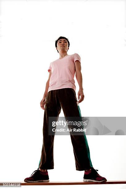 japanese man standing on a bench - low angle view ストックフォトと画像