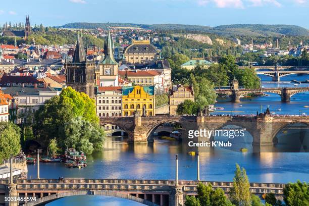 charles bridge, landmark for people who want to travel, and layer of bridge over the river and prague old town from aerial or top view at prague, czech republic, europe - prague tram stock pictures, royalty-free photos & images