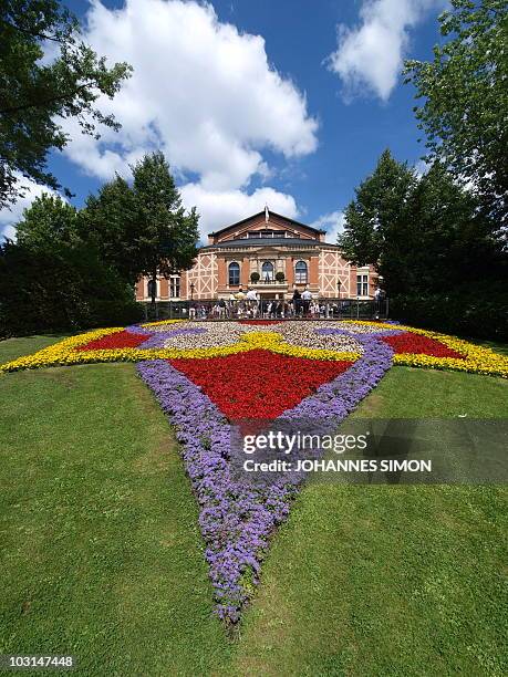 Flowers blossom in front of the 'Festspielhaus' ahead of the opening performance of 'Lohengrin' at the Richard Wagner opera festival in the southern...