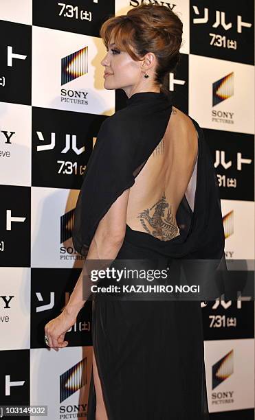 In a picture taken on July 27 US actress Angelina Jolie poses for photographers at the premiere of her latest film, the spy-thriller "Salt" in Tokyo....