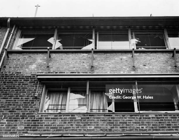 Broken windows in a nearby building after an unsuccessful attempt by the Irish Republican Army to blow up Hammersmith Bridge in west London, 29th...