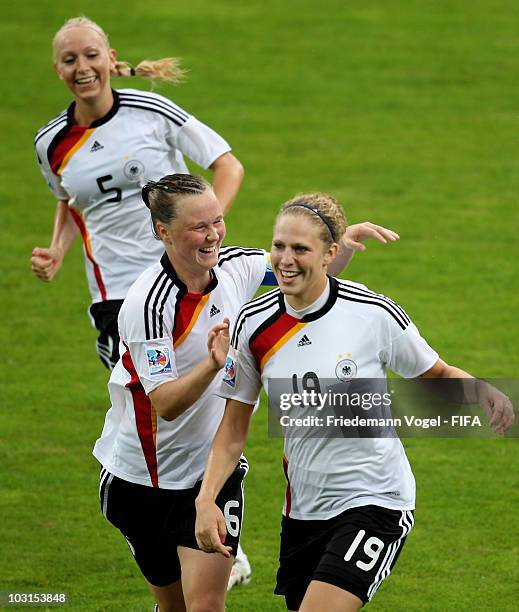 Kim Kulig of Germany celebrates scoring the second goal with Marina Hegering and Kristina Gessat during the FIFA U20 Women's World Cup Semi Final...