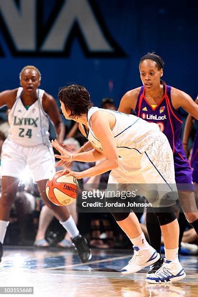 Nuria Martinez of the Minnesota Lynx dribbles the ball up court during the WNBA game against the Phoenix Mercury on July 24, 2010 at the Target...
