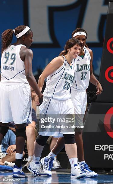 Nuria Martinez of the Minnesota Lynx gets support from team members during the WNBA game against the Phoenix Mercury on July 24, 2010 at the Target...