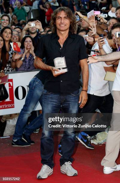 Singer Luciano Ligabue poses with the Francois Truffaut Award during Giffoni Experience 2010 on July 29, 2010 in Giffoni Valle Piana, Italy.