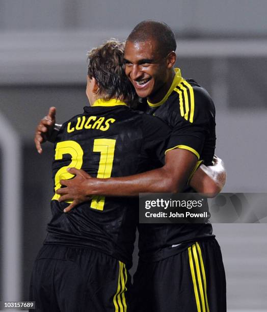 David N'Gog of Liverpool celebrates his opening goal with captain Lucas Leiva during the UEFA Europa League Qualifying Round match between FK...