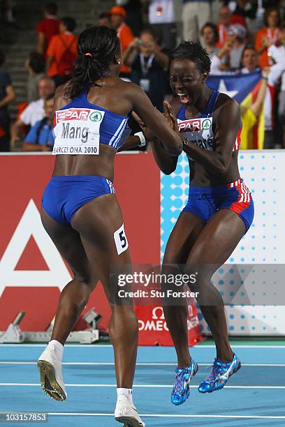 Silver medallist Veronique Mang of France celebrates with Myriam Soumare of France after the Womens 100m Final during day three of the 20th European...