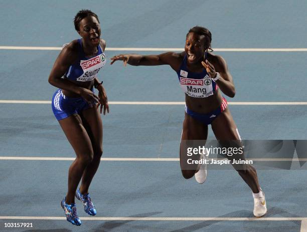 Silver medallist Veronique Mang of France celebrates with Myriam Soumare of France after the Womens 100m Final during day three of the 20th European...
