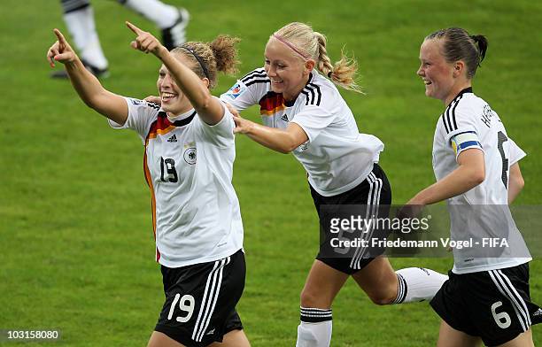 Kim Kulig of Germany celebrates scoring the second goal with Marina Hegering and Kristina Gessat during the FIFA U20 Women's World Cup Semi Final...