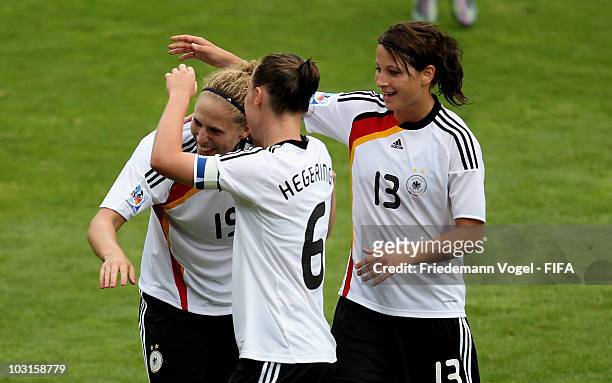 Kim Kulig of Germany celebrates scoring the fourth goal with Marina Hegering and Sylvia Arnold during the FIFA U20 Women's World Cup Semi Final match...