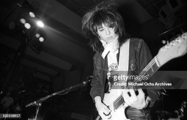 Rock and roll musician Chrissie Hynde of "The Pretenders" performs onstage with a Fender Telecaster electric guitar in April 1980 in San Diego,...