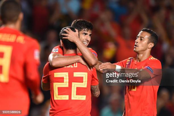 Isco of Spain celebrates with team mates as he scores his team's sixth goal with Marco Asensio and Thiago Alcantara during the UEFA Nations League A...