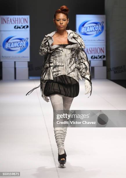 Model walks the runway wearing Andres Lopera during Colombiamoda 2010 at Plaza Mayor on July 27, 2010 in Medellin, Colombia.