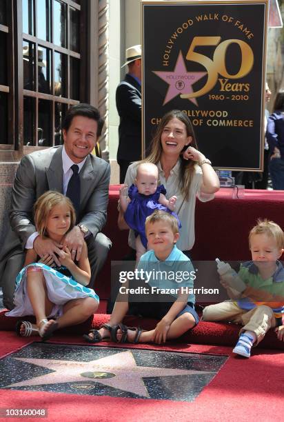 Actor Mark Wahlberg is honored on The Hollywood Walk Of Fame with the 2414th Star poses with his family wife Rhea Durham and their children Ella,...