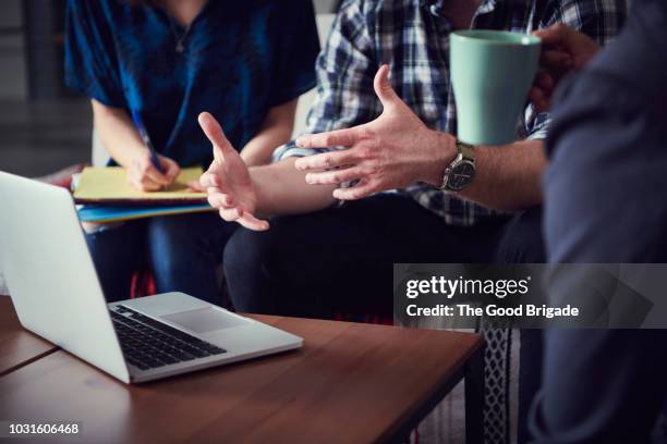 businessman discussing project with coworkers - hands gesturing stock pictures, royalty-free photos & images