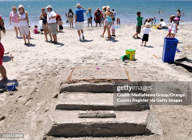 The door steps to the castle with a copy of the Grunion Gazette on the first step during 75th. Annual Great Sand Sculpture Contest in Belmont Shore...