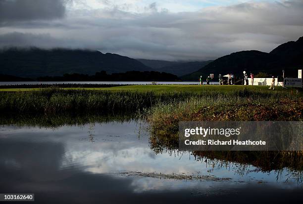 Francois Delamontagne of France tee's off at the 1st watched by David Howell of England and Anders Hansen of Denmark during the second round of the 3...