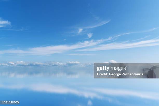 cloud reflection in a calm lake - ijsselmeer stock pictures, royalty-free photos & images