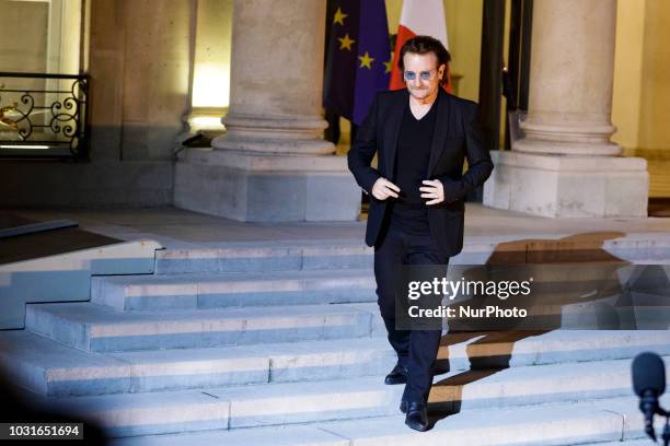 Irish lead singer of rock band U2, Paul David Hewson aka Bono in the courtyard of the Elysee Palace, in Paris, after a meeting with French President,...