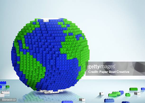 3d globe made of toy building blocks - building blocks stock illustrations
