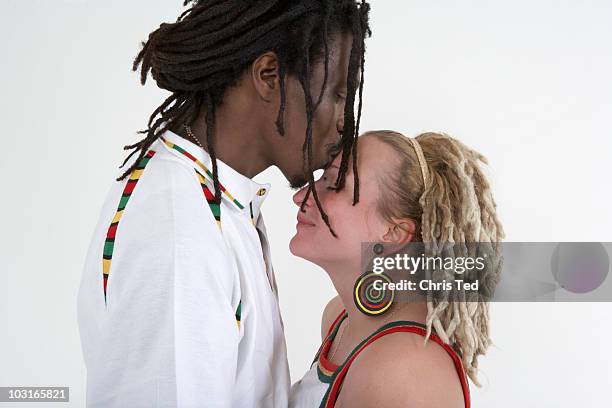 rasta couple kissing and in tight embrace - white rasta stock pictures, royalty-free photos & images