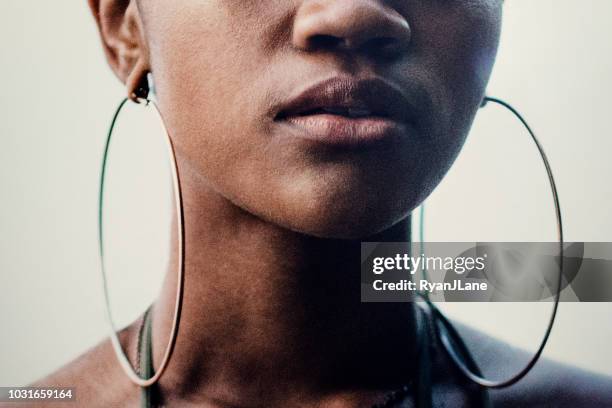 close up portrait of young womans face - earring closeup stock pictures, royalty-free photos & images